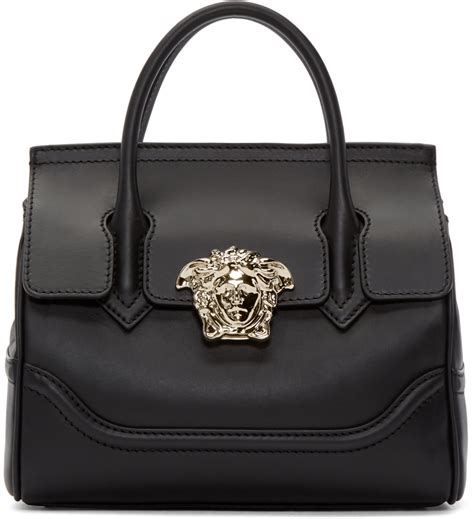 versace lion bottle in leather|Versace black and white purses.